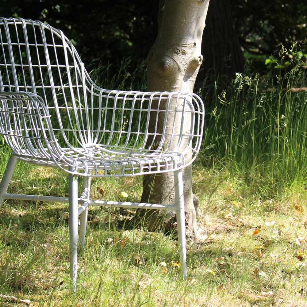 Tunis Armchair Putty - shown in a wild meadow