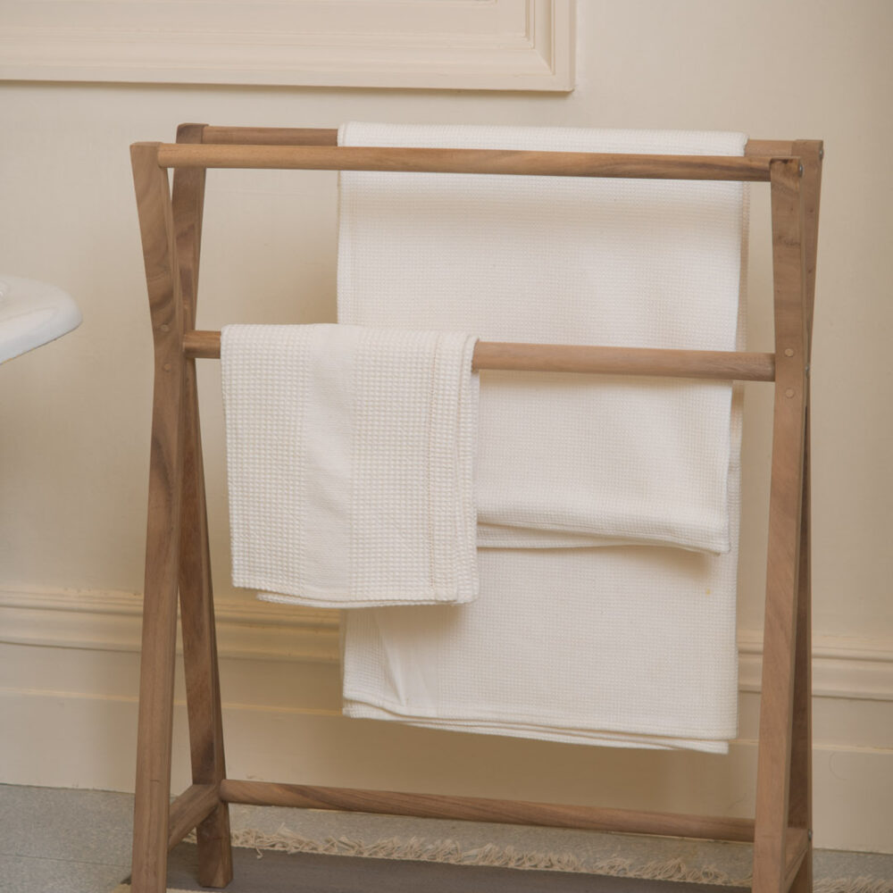 totem wooden towel rail - pictured in a bathroom with an elements dhurrie