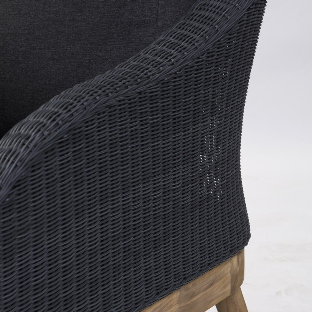 A detail shot of the Harris outdoor sofa with handwoven slate material and teak frame.