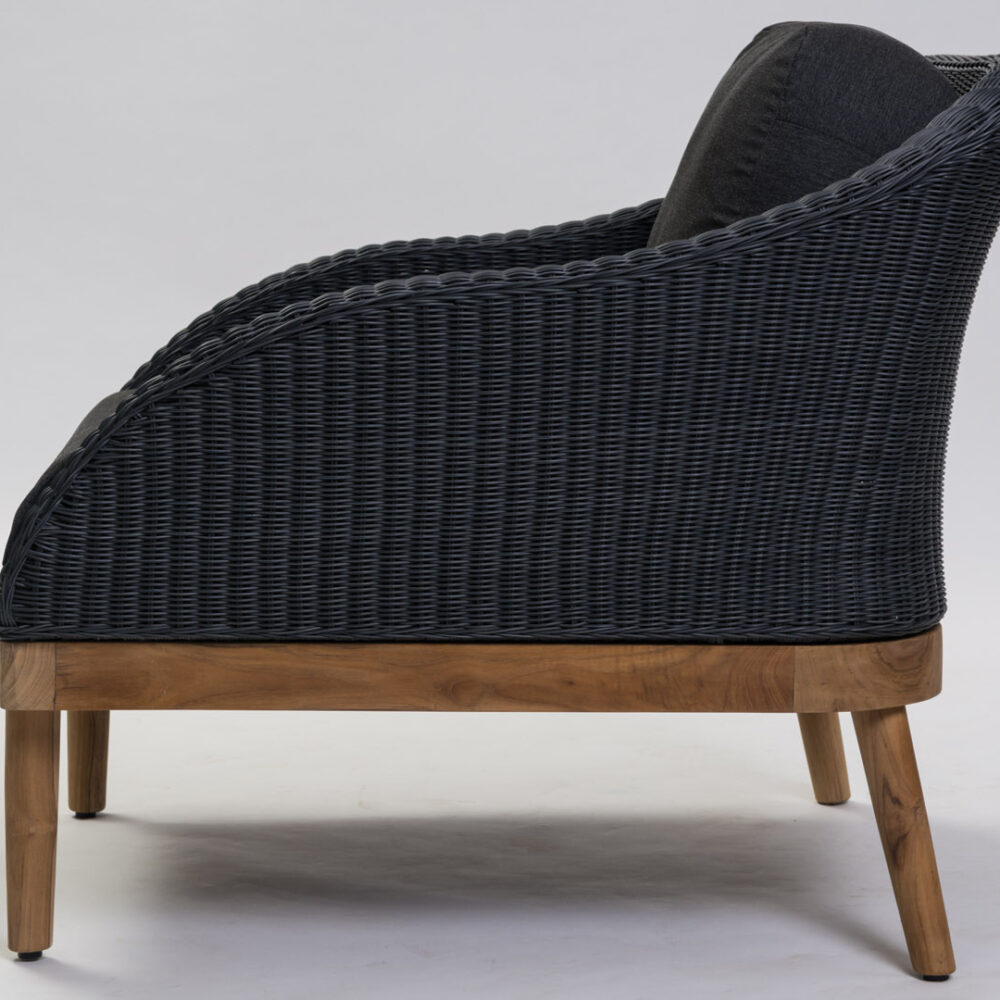 Side view of Harris contemporary outdoor armchair in slate weave with teak base and out door pads.