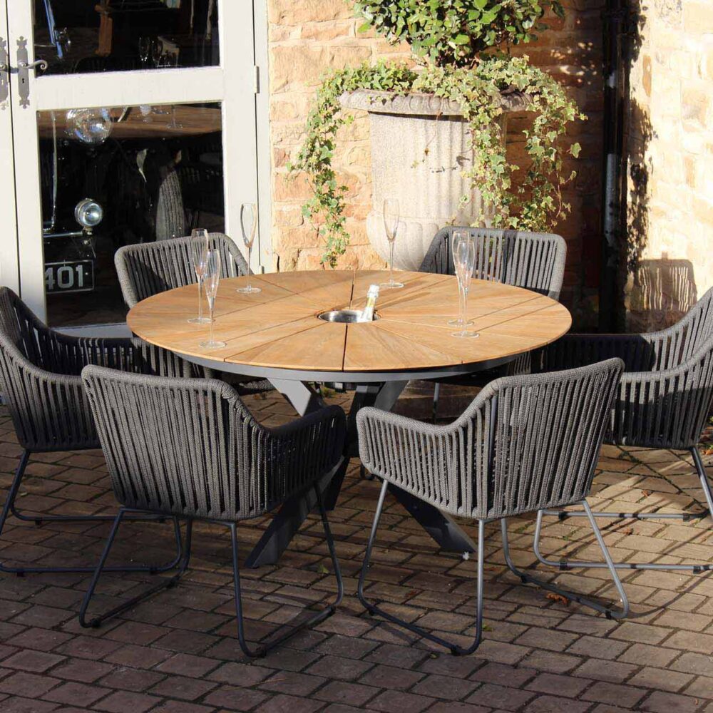 biarritz outdoor dining table with concealed ice bucket - show with genoa armchairs